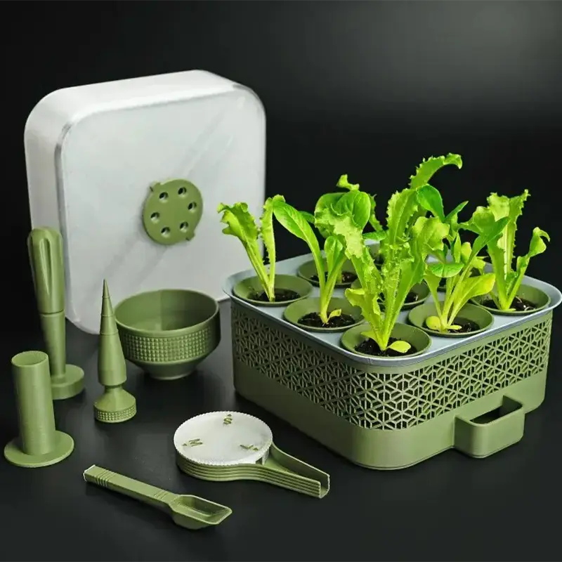 3D printed modular seed starter system with multiple cells containing young plants in greenhouse environment