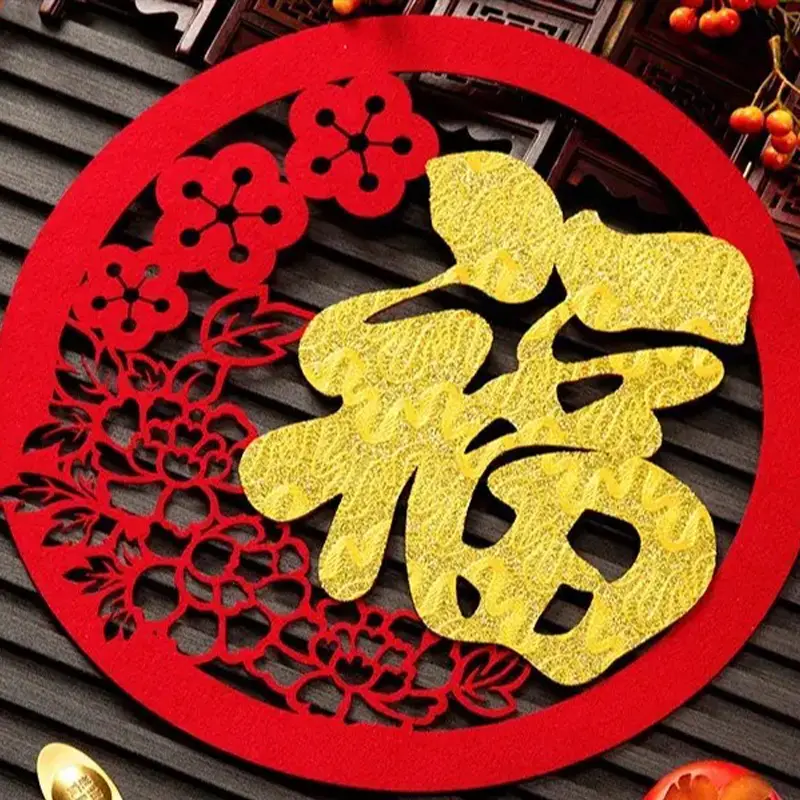 Circular red 3D printed Fu window hanging with gold character and镂空 patterns, displayed on dark wood with berries and yuanbao