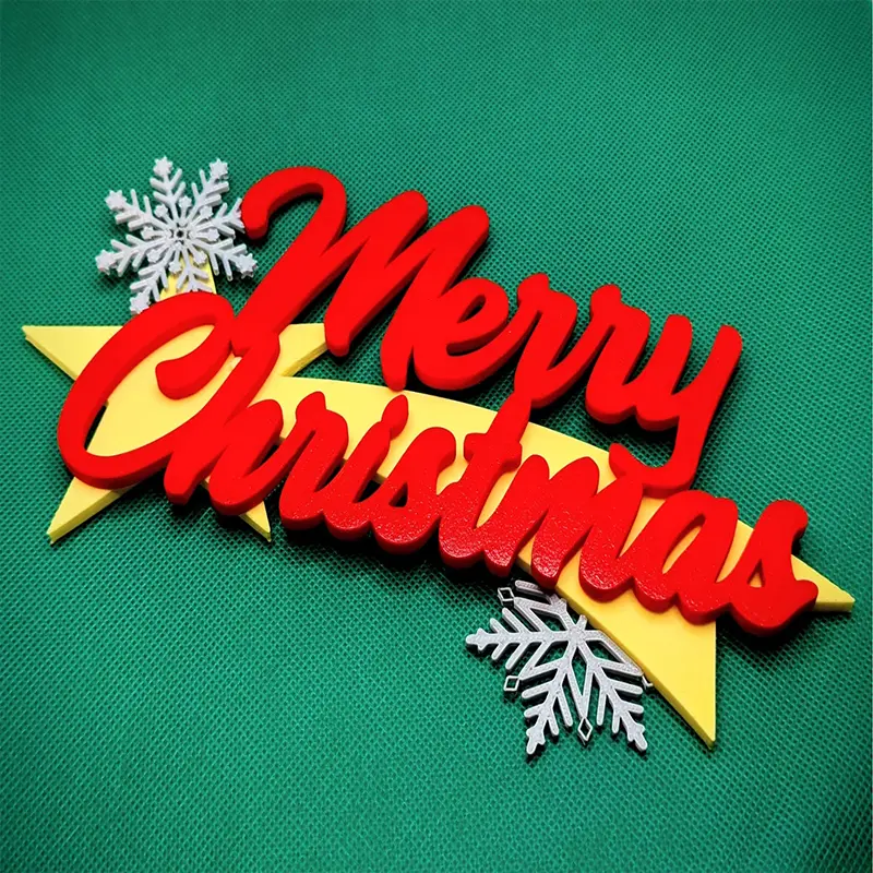 Set of glossy red 3D printed "Merry Christmas" letters with snowflake decorations and gold star base