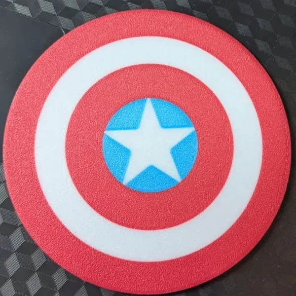Red, white and blue patriotic shield coaster with star design, shown on wooden surface with China Post packaging elements