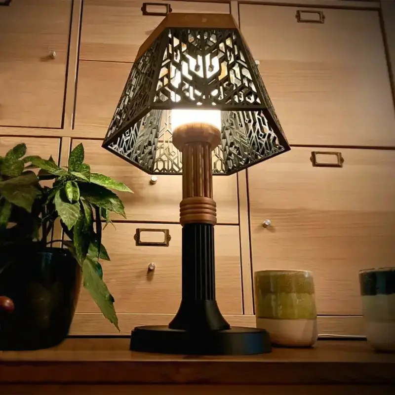 Modern 3D printed geometric grid-desk lamp illuminating a contemporary workspace with warm light