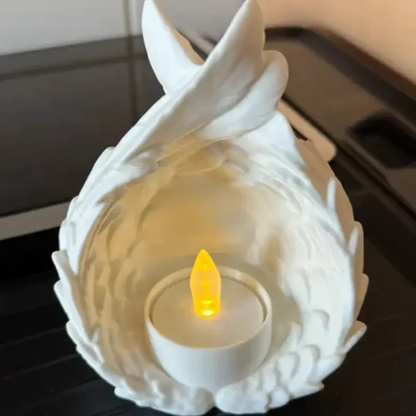Celestial wing illumination tea light showcasing detailed design for B2B clients