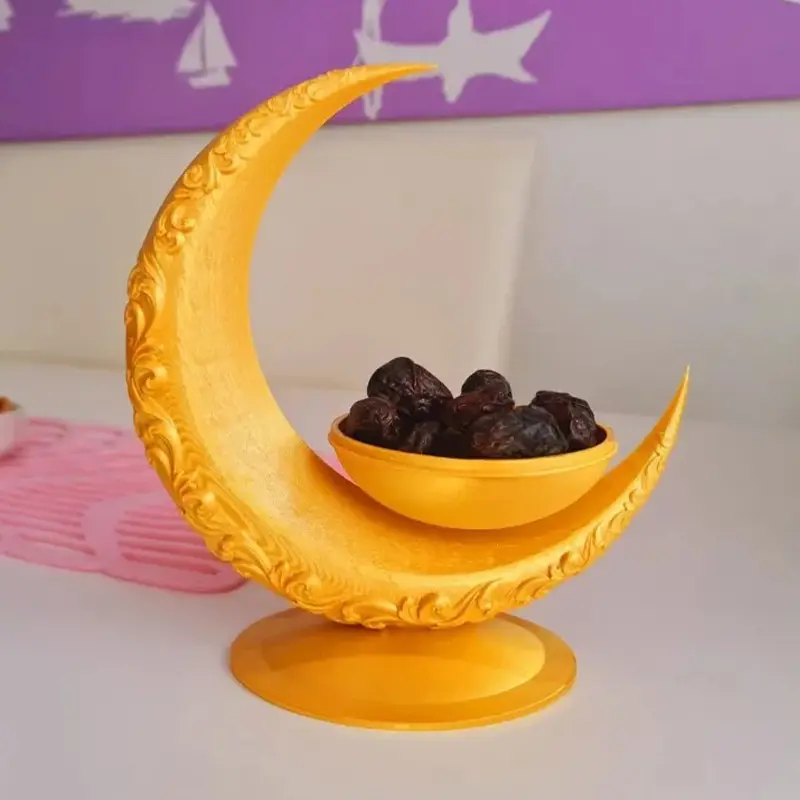 Gold 3D printed Ramadan festive snack bowl filled with dates, showcasing crescent moon shape and intricate patterns