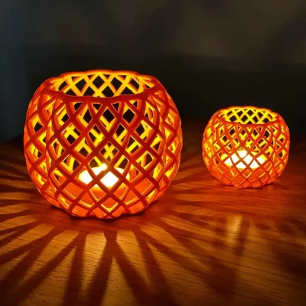 3D printed Halloween lantern shades with intricate lattice patterns on a wooden table, emitting a soft glow for B2B decor