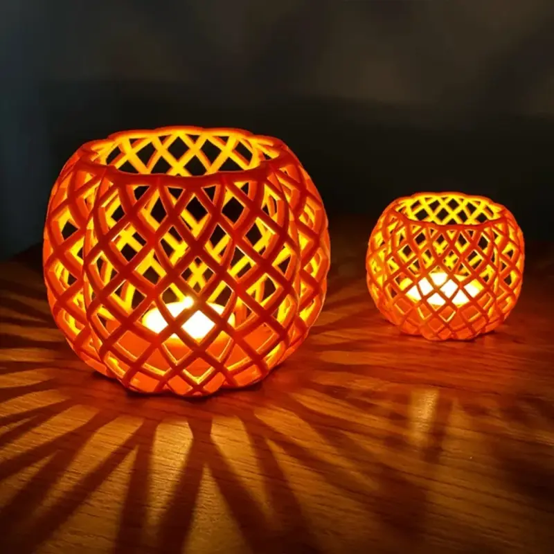 3D printed Halloween lantern shades with intricate lattice patterns on a wooden table, emitting a soft glow for B2B decor