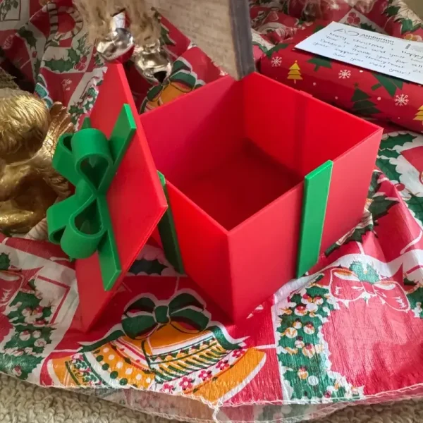 Close-up view of precision 3D printed gift box ornament showing bow details and smooth finish