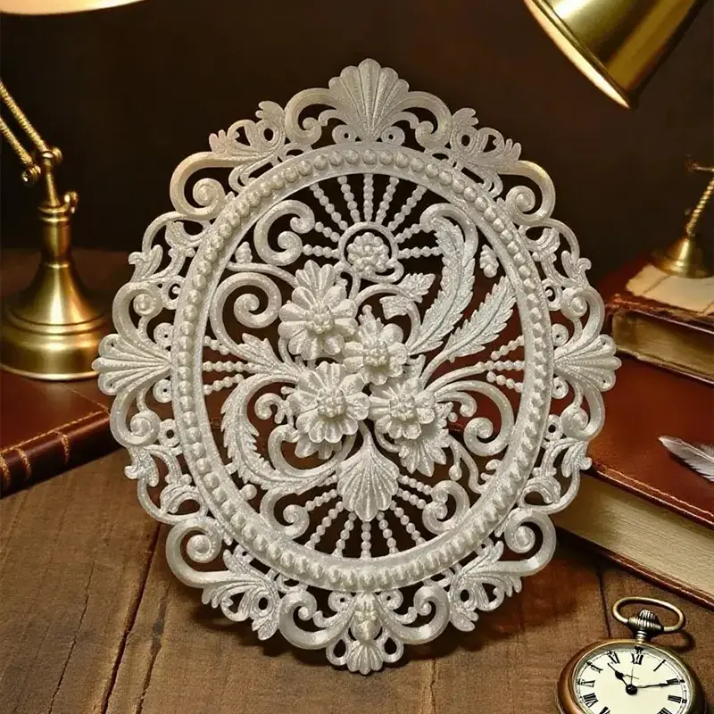 White 3D printed ornamental Baroque window with intricate patterns displayed on wooden surface