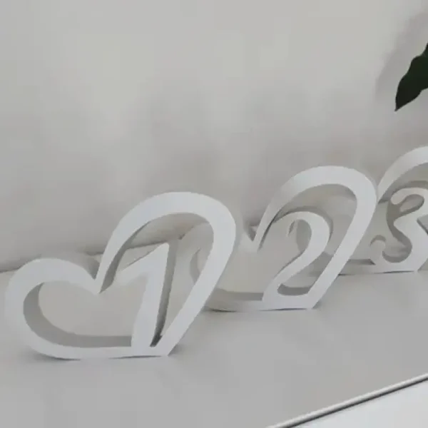 Close-up of 3D printed wedding table markers showcasing precise numbers and modern design for B2B clients