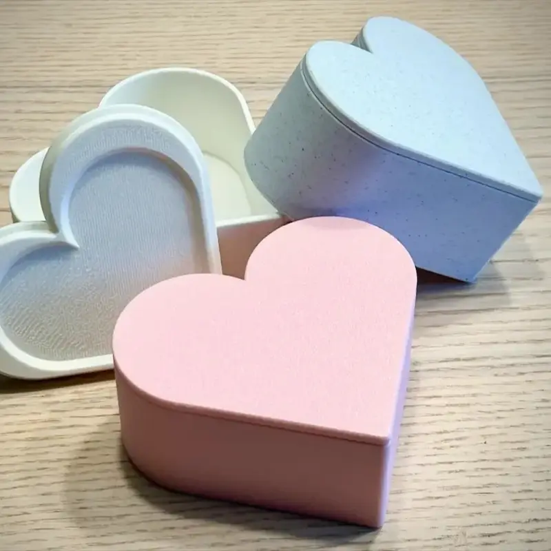 Set of three eternal vow keepsake boxes in pink, white, and blue colors with heart-shaped design for wedding mementos