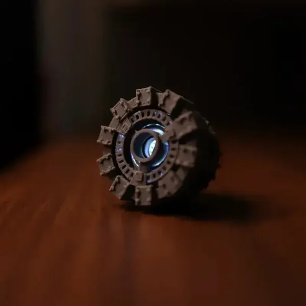 Close-up of Arc Reactor display showcasing glowing center and "TONY S HARD HAS A HEART" text for B2B clients
