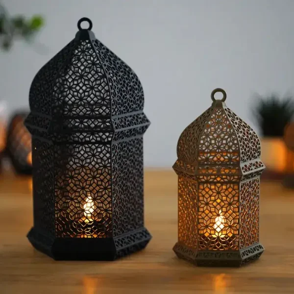 Large and small geometric-patterned Arabic lamps displayed on wooden surface, showing intricate design details