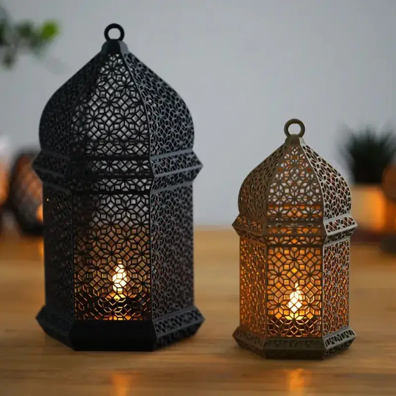 Large and small geometric-patterned Arabic lamps displayed on wooden surface, showing intricate design details