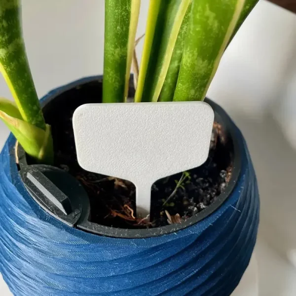 Close-up of 3D printed plant identification tag showing clear lettering and professional design