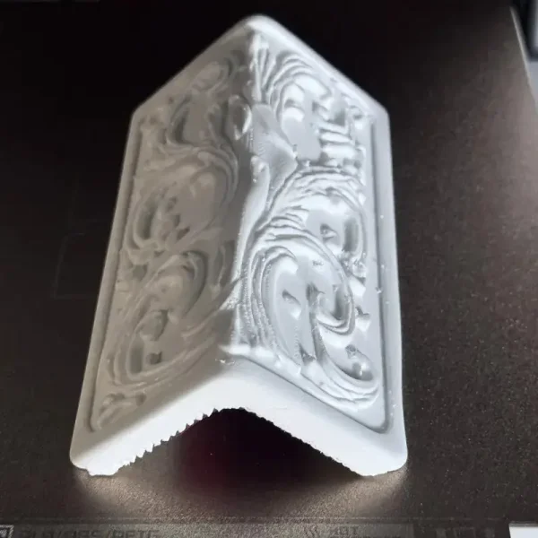 Close-up view of Baroque ornamental edge guard showing glossy finish and ornate patterns for B2B clients