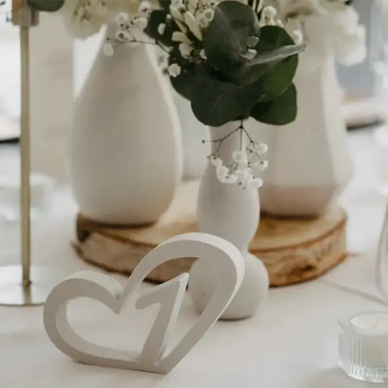 Premium 3D printed wedding table markers shown in a elegant reception setting with clean design