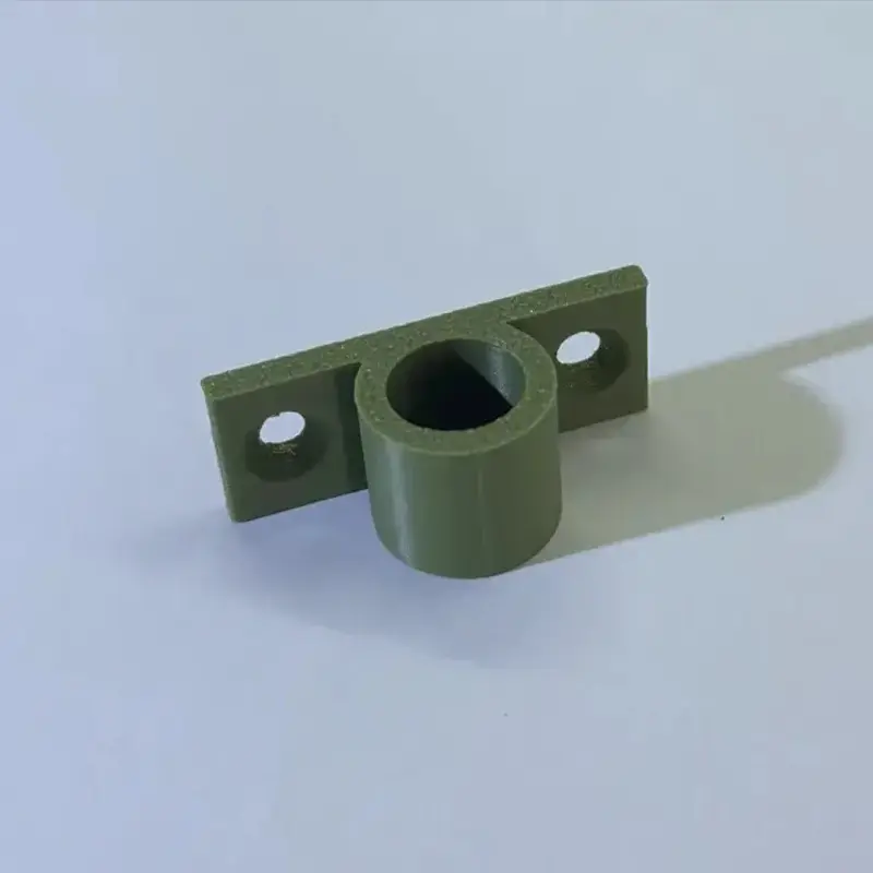 3D printed wall-mounted support bracket in olive-green color with mounting holes on white background