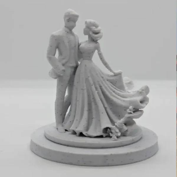 Close-up of the wedding couple sculpture highlighting detailed attire and romantic setting for B2B clients