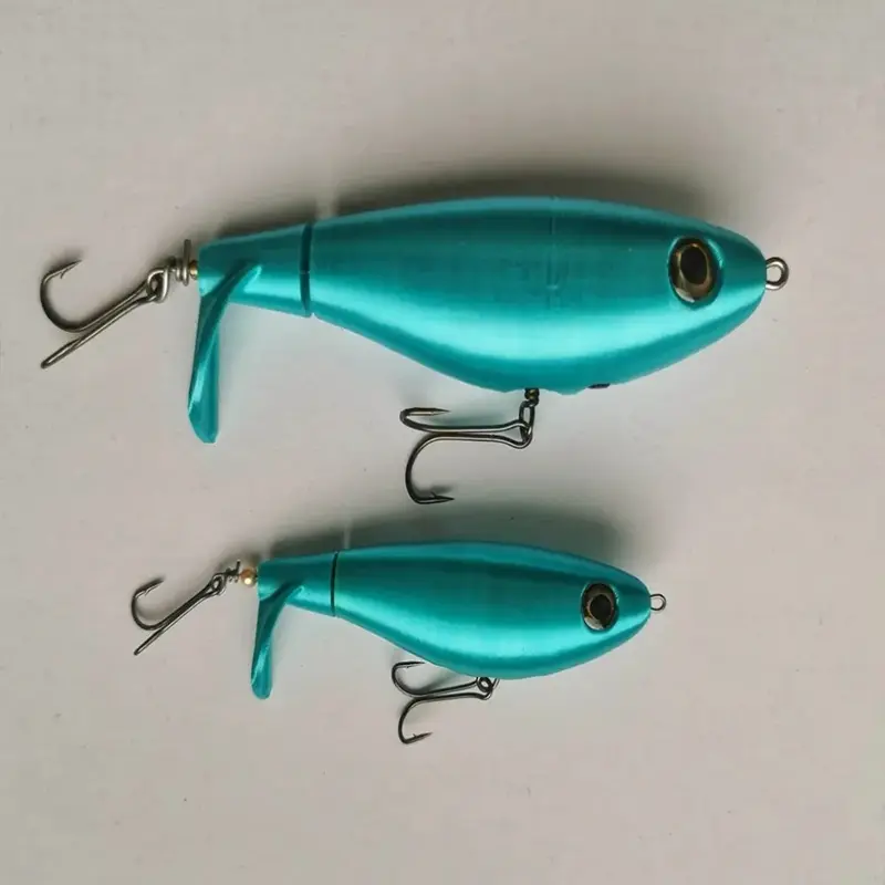 Set of turquoise custom fishing lure designs with metal hooks, showing sima and handmade markings