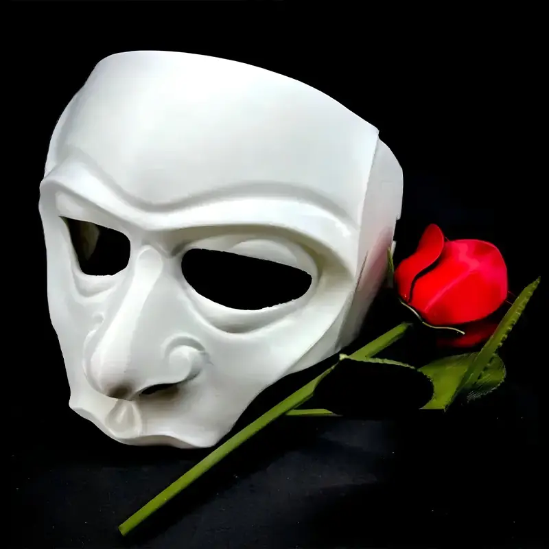 A white 3D printed Halloween mask displayed next to a red rose, showcasing intricate details and custom design for B2B clients