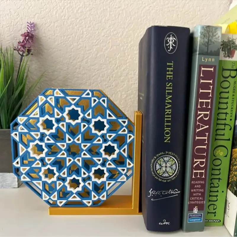 White 3D printed vertical book organization system holding "THE SILMARILLION" and other books, showing elegant typography design