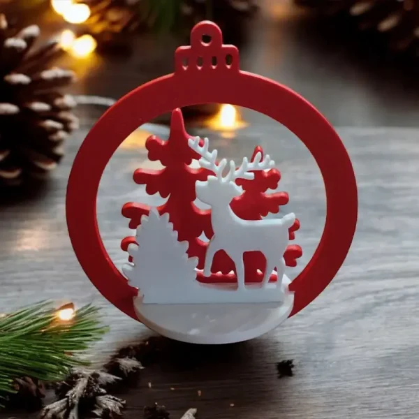 Red and white 3D printed deer ornament with snowflakes and trees featuring "Merry Christmas" text on wooden surface