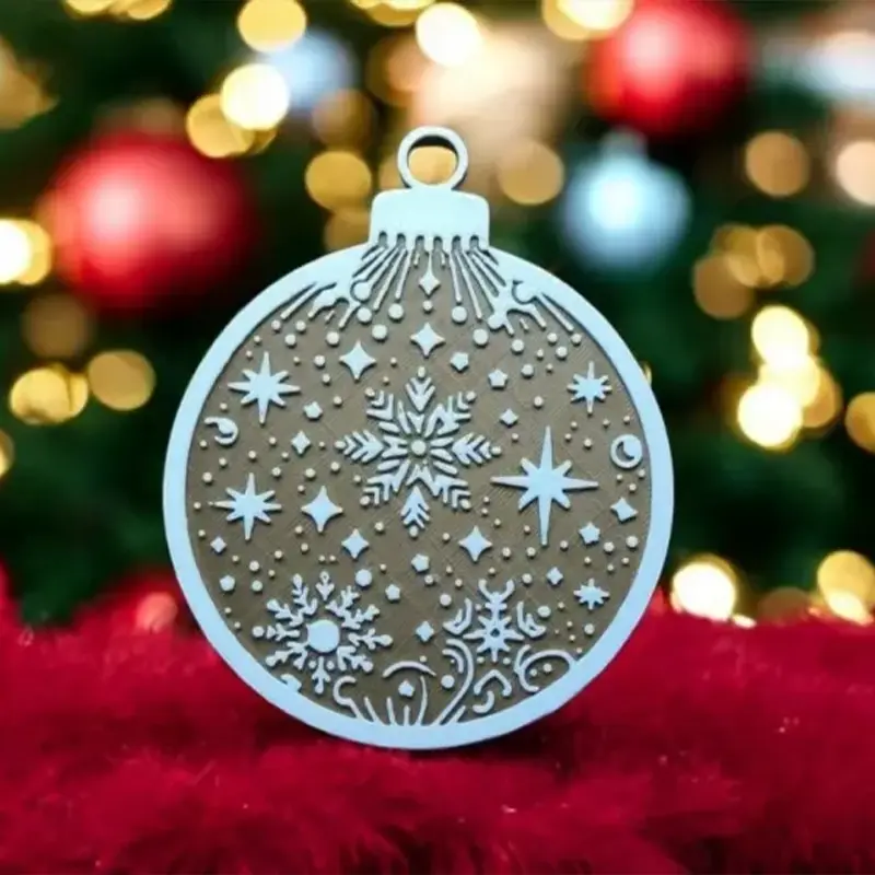 Milky-white 3D printed Christmas ornament with intricate snowflake and star patterns hanging against blurred Christmas tree lights