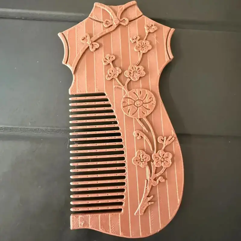 Artisanal 3D printed cheongsam-designed comb featuring intricate floral patterns and elegant dress silhouette for B2B clients