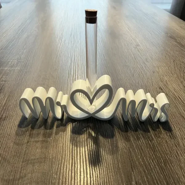 Detailed view of Mr & Mrs money vase showing interlocking letters and glass tube insert for B2B clients