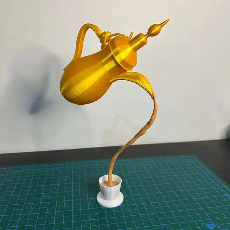 3D printed hovering Arabian coffee pot decor with golden finish, showing detailed levitation design on a neutral background