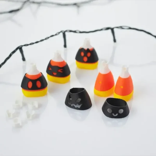Close-up of candy-shaped LED bulbs showing customizable expressions and wiring for B2B holiday decor solutions