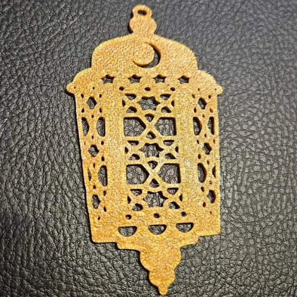 Detailed view of ornate Islamic pendant keychains showing intricate geometric patterns for B2B clients
