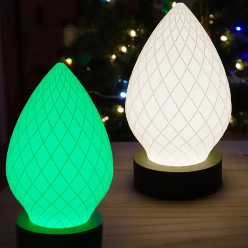 Premium green 3D printed lamp shade with intricate diamond-grid pattern, displayed on wooden surface with Christmas tree