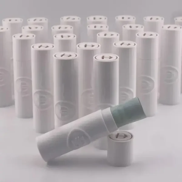 Set of white cylindrical 3D printed Eid financial gift kits with technical markings HD, AE, GLUE, PVA, and 0.5M