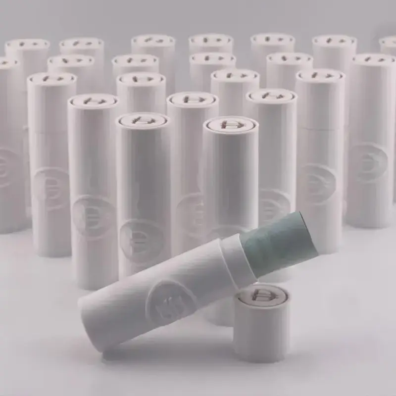 Set of white cylindrical 3D printed Eid financial gift kits with technical markings HD, AE, GLUE, PVA, and 0.5M