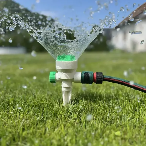 3D printed precision irrigation nozzle attached to hose, designed for B2B clients in outdoor settings