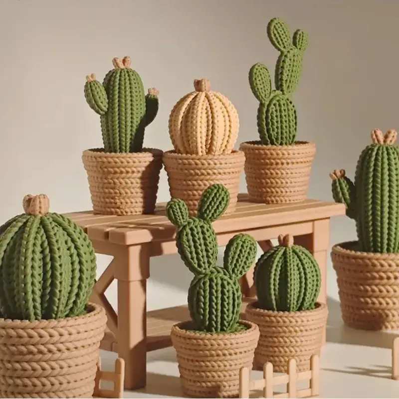 Set of 3D printed cactus sculptures in various shapes and sizes, displayed as decorative pieces for interior spaces