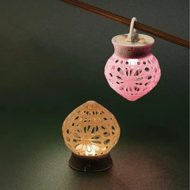 Elegant 3D printed tree-fruit lamp with intricate cut-outs emitting soft light, perfect for B2B commercial spaces