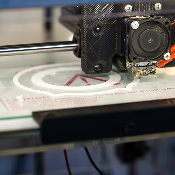 A close-up image of a technician at Yuesun3D using a digital caliper to verify the dimensional accuracy of a high-precision 3D printed component, demonstrating their quality control process.
