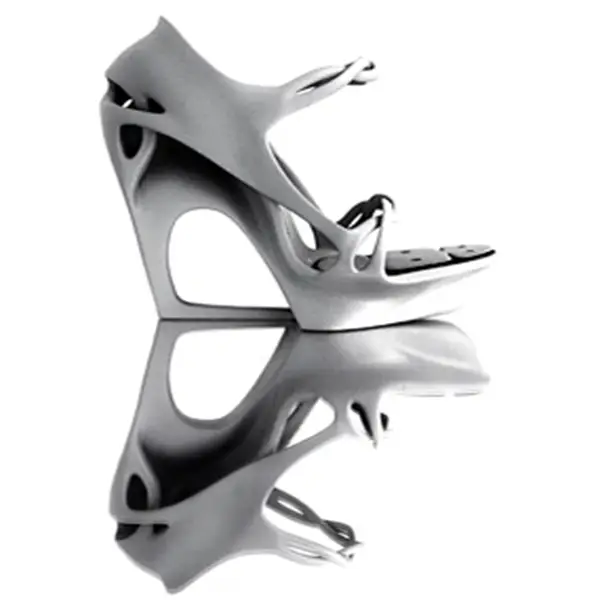 An engineer's hands assembling multiple 3D printed FDM prototype parts together, demonstrating the real-world form and fit testing process.