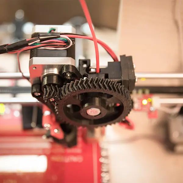 A visual comparison showing a traditionally manufactured multi-part assembly next to a single, complex, organic-shaped part made with Yuesun3D's additive manufacturing services.