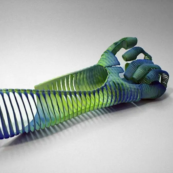 An engineer stress-testing a sturdy, black FDM-printed automotive bracket in a rig, demonstrating the functional application of works-like prototyping.