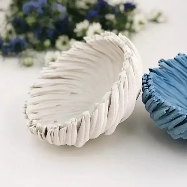 Factory scene showing multiple industrial 3D printers simultaneously producing various personalized gift items including custom keychains, figurines, and promotional products in bulk quantities.